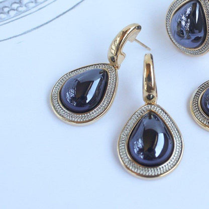 BRINCO FOLHEADO A OURO E RÓDIO BRANCO COM EFEITO PEROLADO