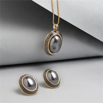 Conjunto Brilhato folheado a ouro com ródio negro e pérolas shell — referência 031256503